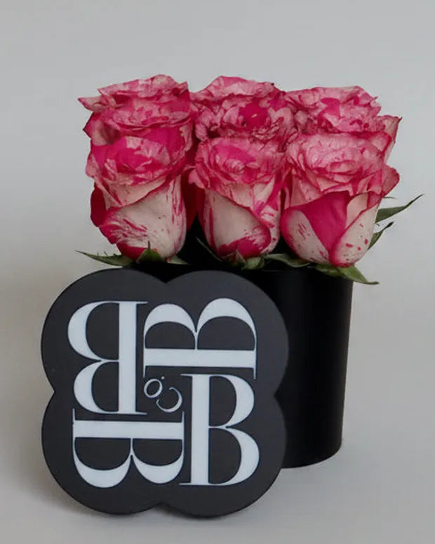 Mini Signature Emblem Box, speckled pink roses in a black box with the BB and Co emblem