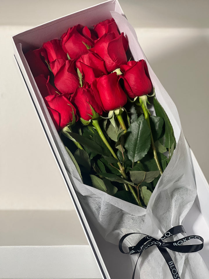 Love Struck, long stem red roses in an open white gift box