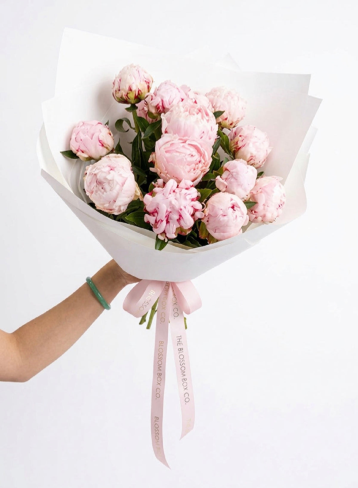 Pretty In Pink Peonies, a bunch of soft pink Sarah Bernhardt peonies in white wrap with a pink ribbon