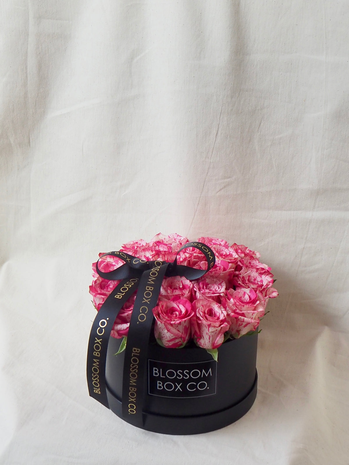 Rose Hat Box of pink roses in a black hat box, side view, photo 2 of 6