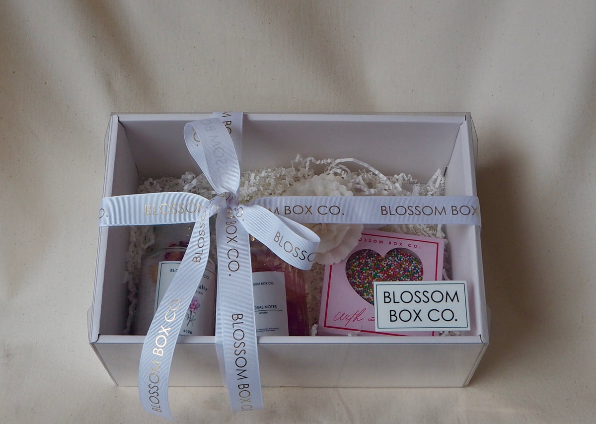 Treat Me Hamper with a freckle heart and pamper gifts in a white gift box tied with Blossom Box Co ribbon, photo 1 of 2